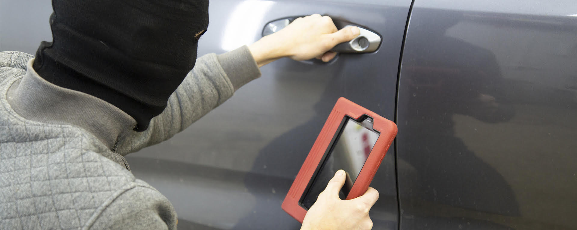 A couple smiling and reviewing a piece of paper