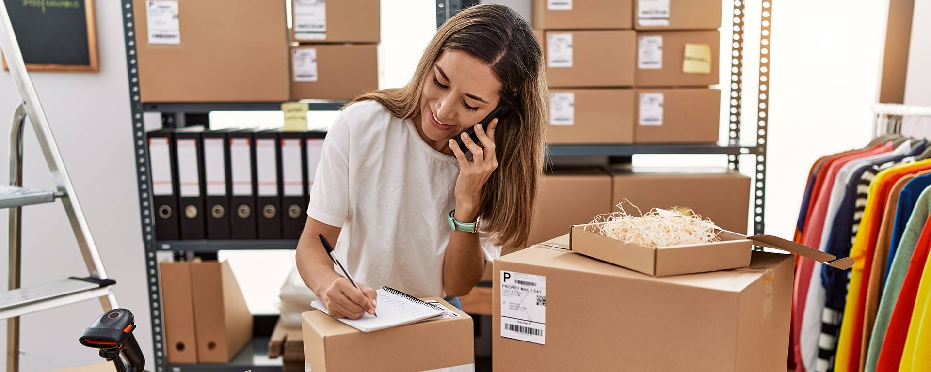 Small business owner preparing boxes for shipment